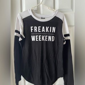 Long sleeve top stating “freakin’ weekend”